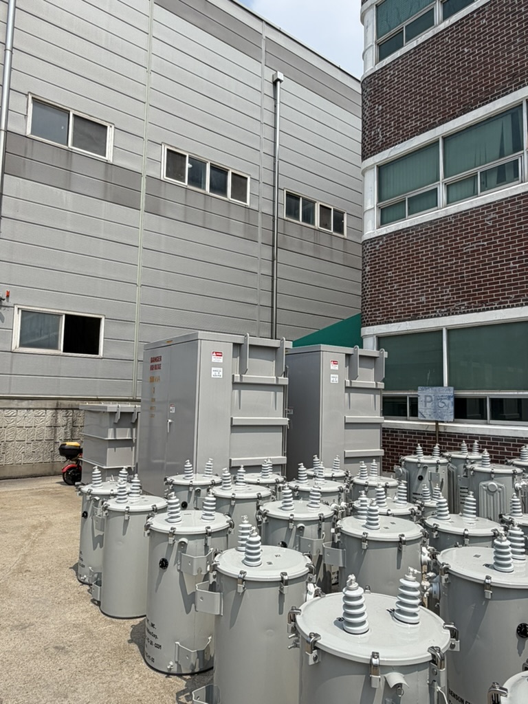 Pad-mounted and pole-mounted transformers outside the factory